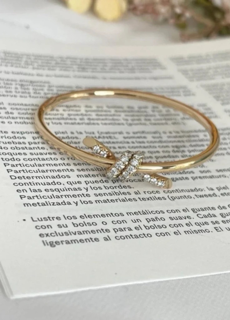 Tiffany Knot Wire Bangle in Yellow Gold with Diamonds
$9,600