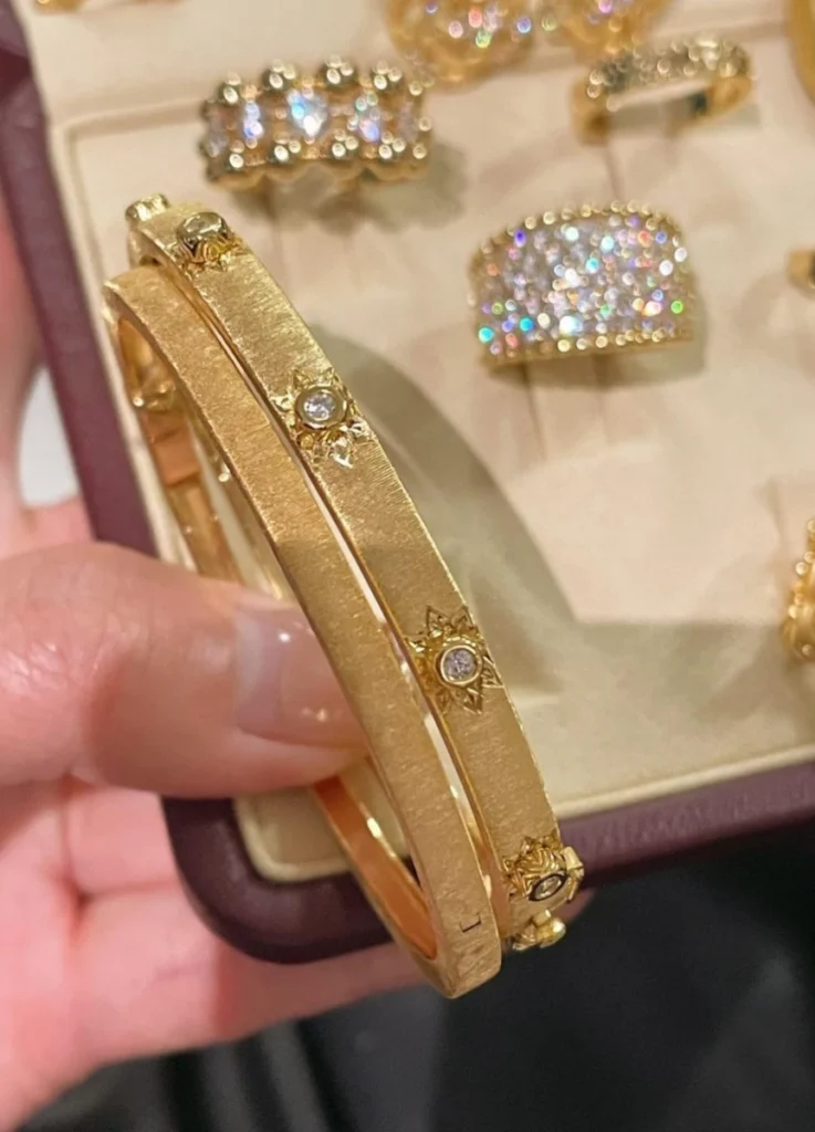 Buccellati MACRI CLASSICA YELLOW GOLD BAND BRACELET ($7,700.00)
MACRI CLASSICA YELLOW AND WHITE GOLD RIGATO BRACELET WITH DIAMONDS ($14,000.00)