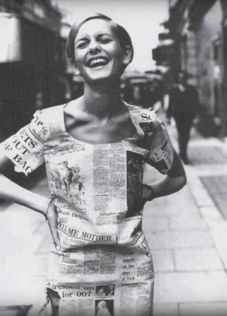 Twiggy, 1967, in a newspaper-print paper dress