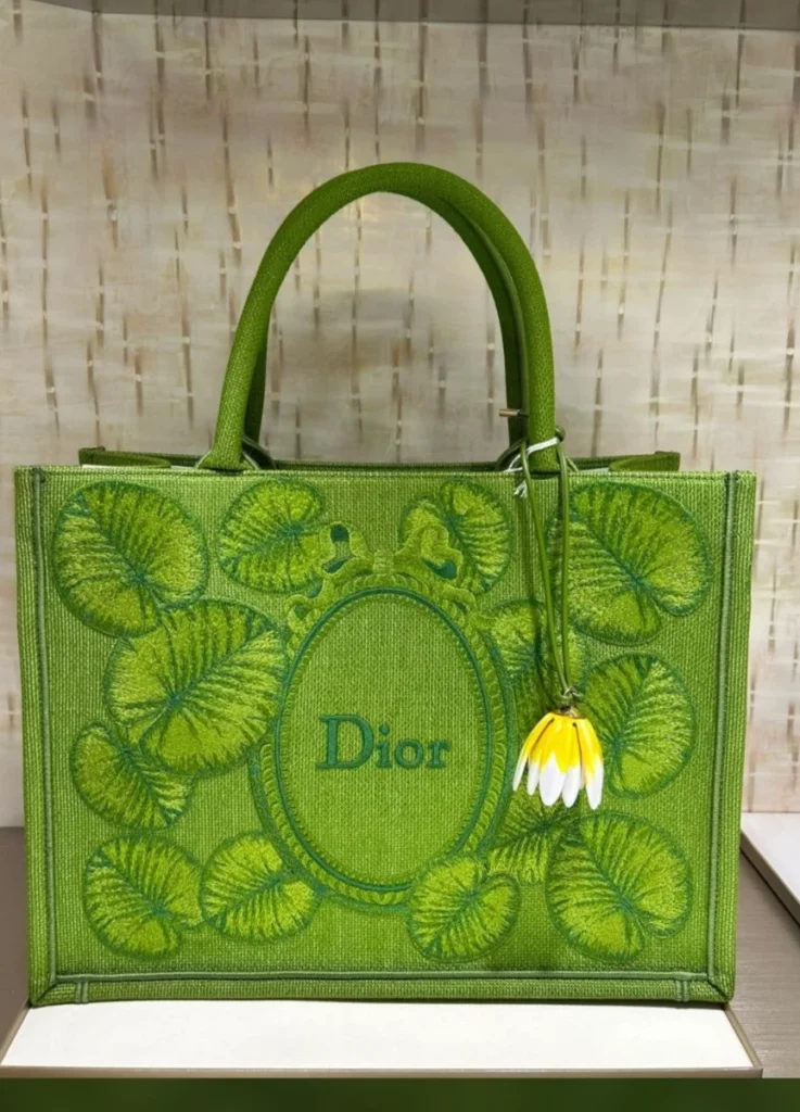 Green Book Tote, tone-on-tone lily pad embroidery with detachable flower charm