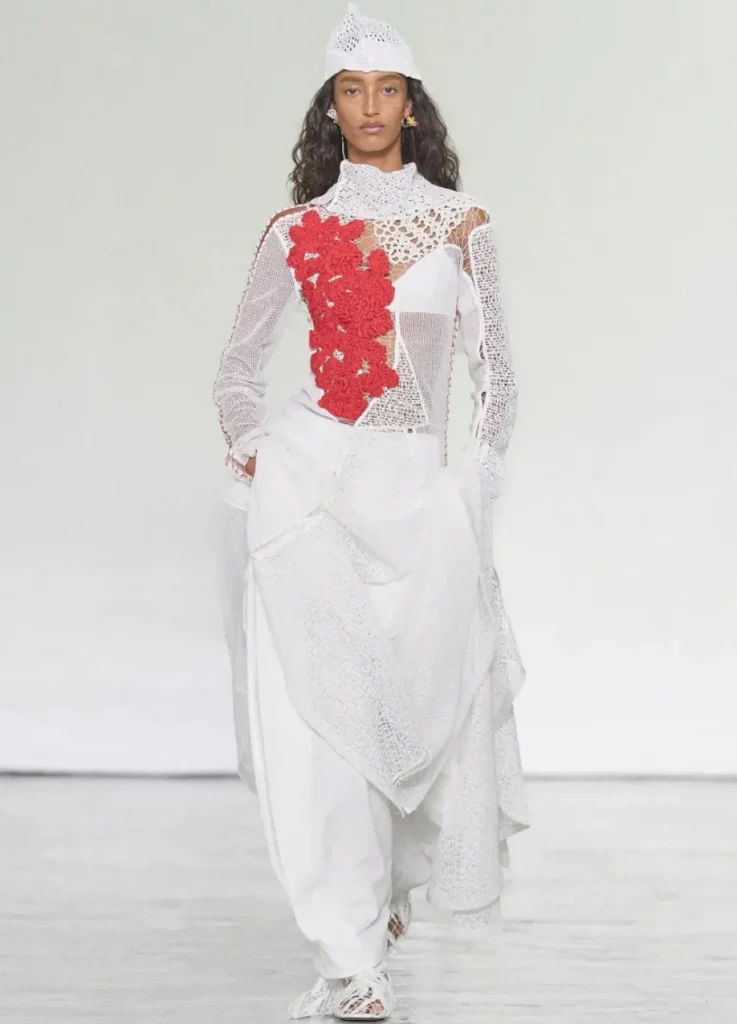 Bottega Veneta Spring 2027 Look 36,
white lace and crochet top with red crochet flowers and white crochet cap