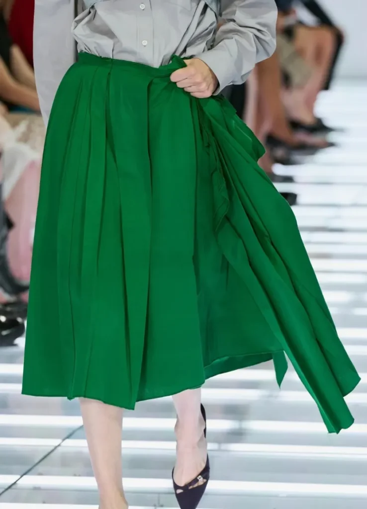 Prada Spring 2027 Look 59 — green asymmetric skirt gathered by hand